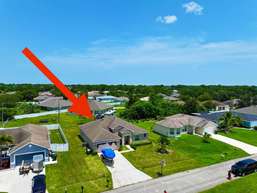 Photo of 3121 SW Hickenlooper Street, Port Saint Lucie, FL 34953 (MLS # R11006166)