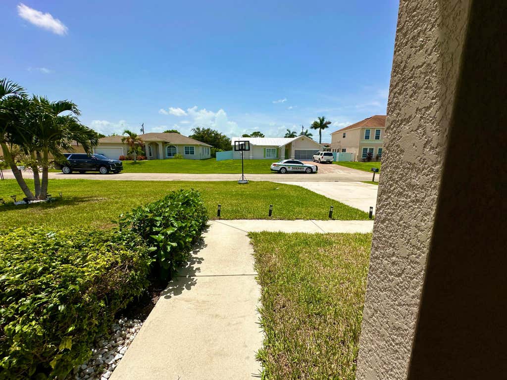 Photo of 3121 SW Hickenlooper Street, Port Saint Lucie, FL 34953 (MLS # R11006166)