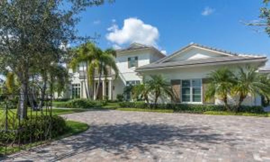 This architecturally stunning designer home offers the timeless elegance of classic estate living with all of the modern amenities expected today. This newly built 4 bedroom 4.5 bath Palm Beach Polo and Country Club estate home is situated on nearly three quarters of an acre of lush landscaping. Enjoy incredible water and golf course views while entertaining around the custom pool or grilling at the outdoor kitchen. The perfect home for those that expect the best. Membership to Palm Beach Polo and Country Club is mandatory at closing.