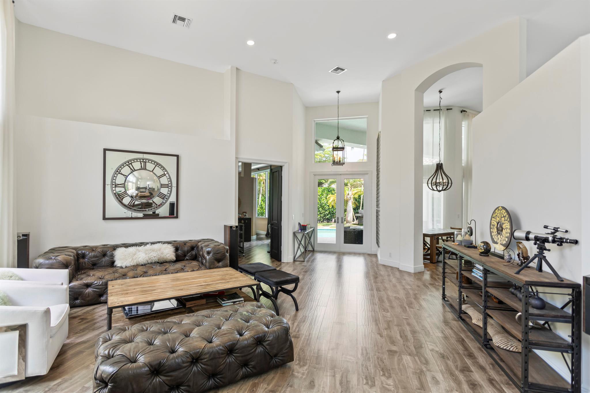 Follow Me Behind the Scenes into luxury living at this exquisite 4-bedroom, 4-bathroom custom courtyard estate in the prestigious Seasons community of Boca Raton. This single-story residence has been thoughtfully redesigned to blend modern elegance with functional living, offering seamless indoor-outdoor spaces and serene courtyard views from every room.The home showcases a chef's kitchen with premium appliances, Quartz and Caesarstone countertops, sleek cabinetry, and designer finishes, complemented by upgraded flooring and spa-inspired bathrooms. Floor-to-ceiling windows and gated terraces flood the interiors with natural light, creating a true oasis of privacy and tranquility.Every detail has been curated with intention -- from reconfigured layouts and custom wall treatments