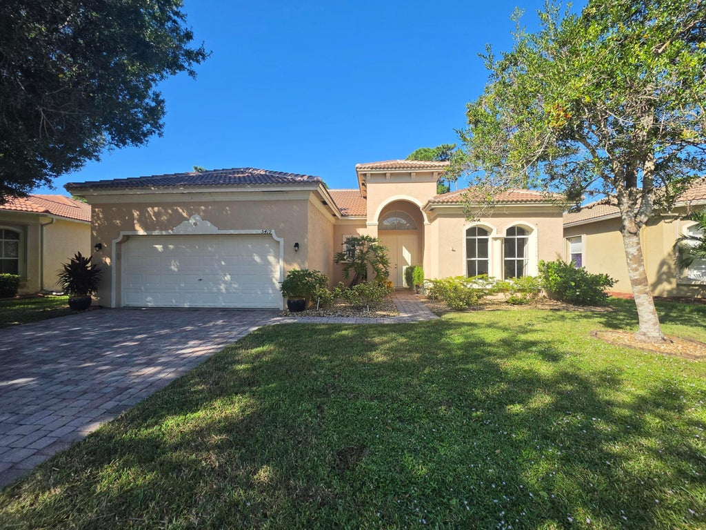 Photo of 5419 PLACE LAKE Drive, Fort Pierce, FL 34951 (MLS # B26092826)