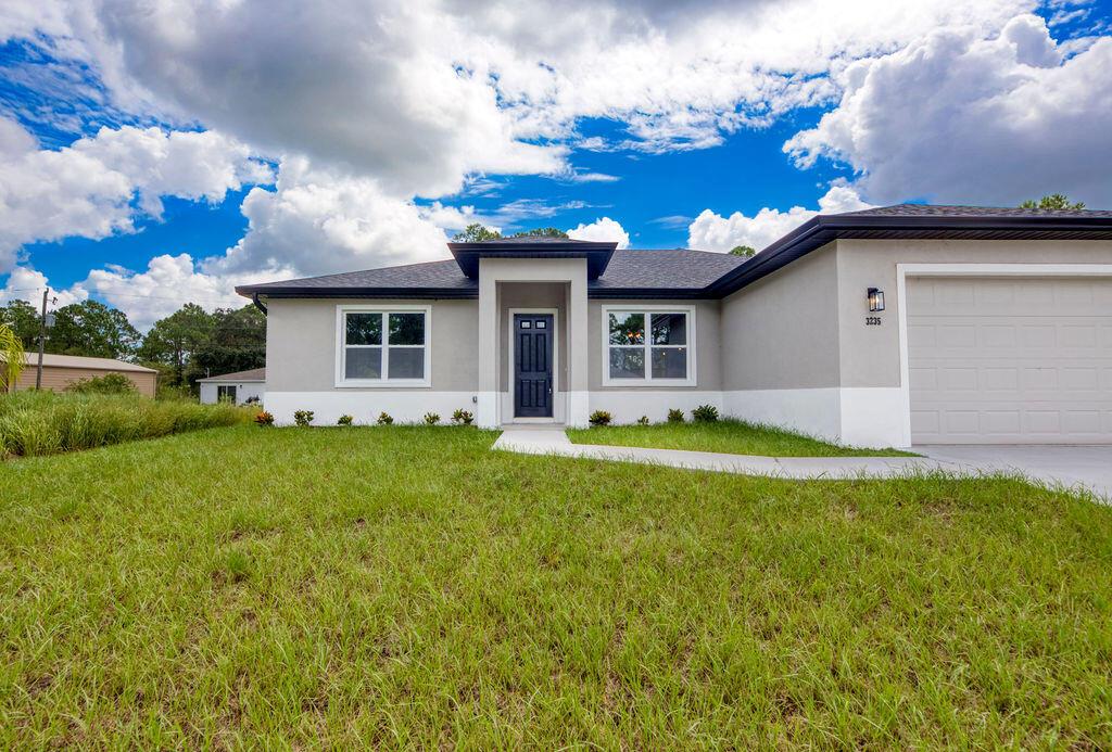 Discover Palm Bay, where expanding communities and a laid-back coastal lifestyle make this area one of Florida's true treasures. This new construction home offers 1,926 sq. ft. of thoughtfully designed space, featuring 3 bedrooms and 2 baths - ideal for families or first-time buyers. Inside, you'll find beautiful and durable LVP flooring, 9- and 10-foot tray ceilings, and a split-bedroom design that provides both privacy and connection. The open living area flows to a generous covered patio, perfect for casual gatherings or quiet evenings outdoors. With hurricane impact windows and all the perks of new construction, this home blends style, security, and a fresh start in the heart of Palm Bay. **Professional photos coming soon**