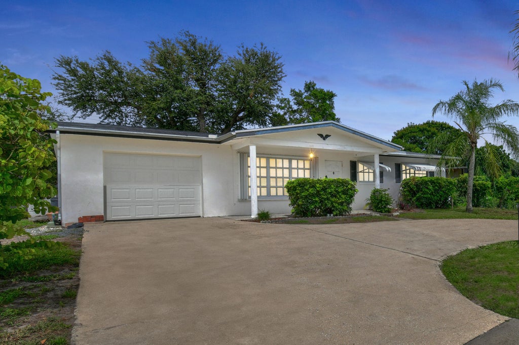 Photo of 303 Holly Avenue, Port Saint Lucie, FL 34952 (MLS # R11008371)