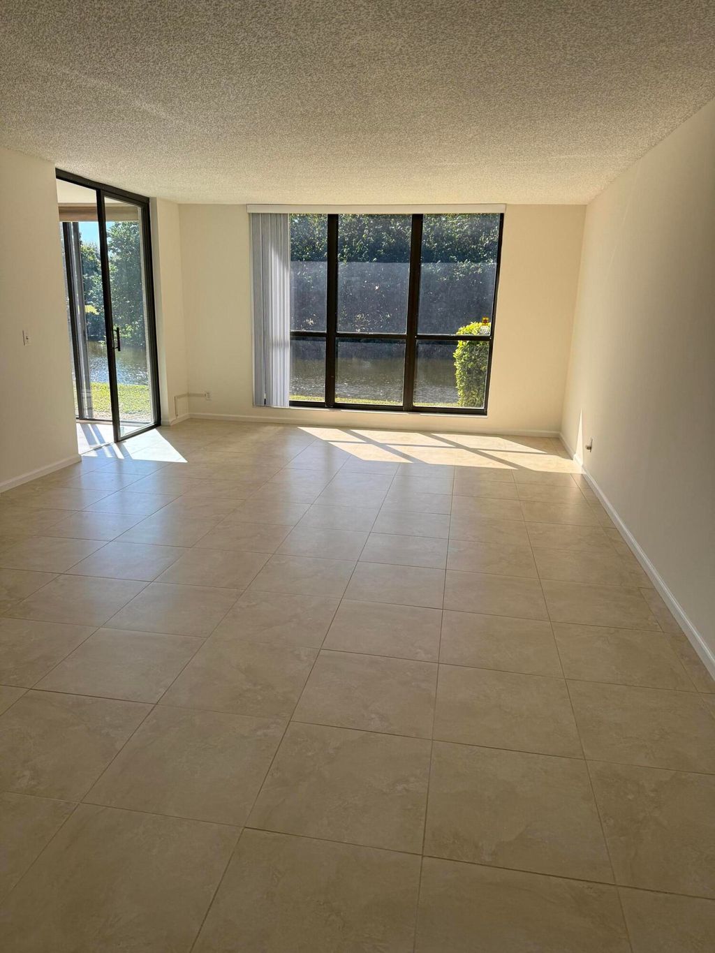 Photo of 5250 Woodland Lakes Drive #130, Palm Beach Gardens, FL 33418 (MLS # R11160260)