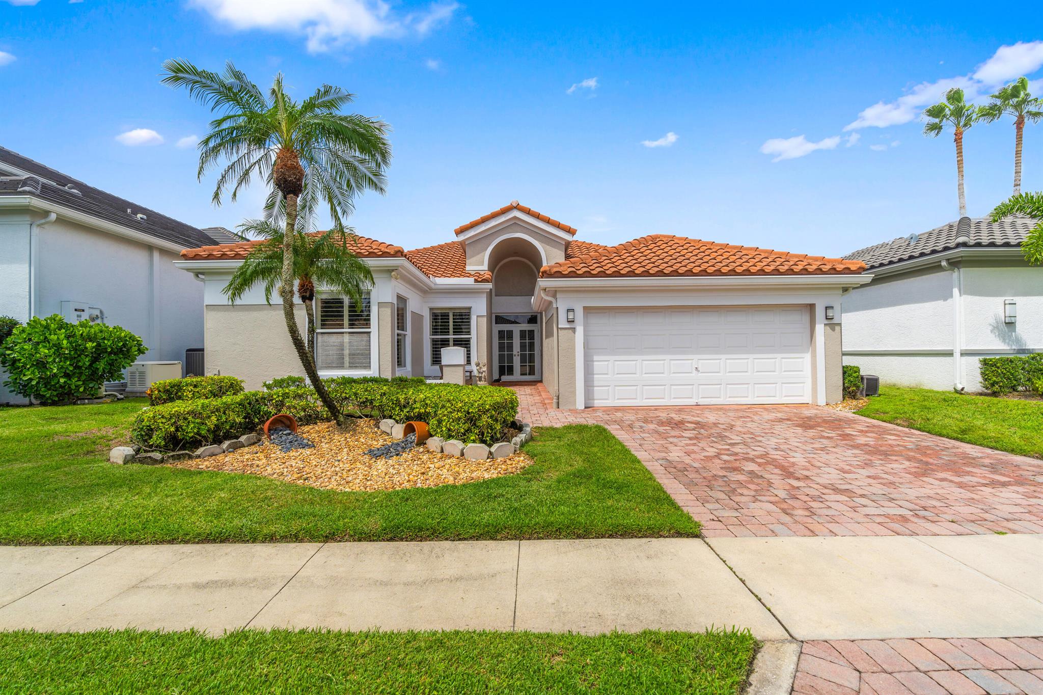 Welcome to Woodfield Country Club! Completely updated in 2015, this single-story 2,317 sq.ft., 4BR/2BA home blends style with peace of mind: a 2015 roof and full hurricane-impact windows and doors, sleek porcelain tile floors carry through the living spaces, a beautiful chef's kitchen with granite countertops, and quartz-finished baths. Outdoor upgrades completed the same year include a re-paved driveway and back patio, plus a pool resurfaced with Diamond Brite. The backyard overlooks the lake creating a calm backdrop for gatherings or quiet mornings. Custom California Closets outfit every closet maximizing storage. And, the water heater was replaced within the last five years. Big-ticket items are handled--move in and enjoy!