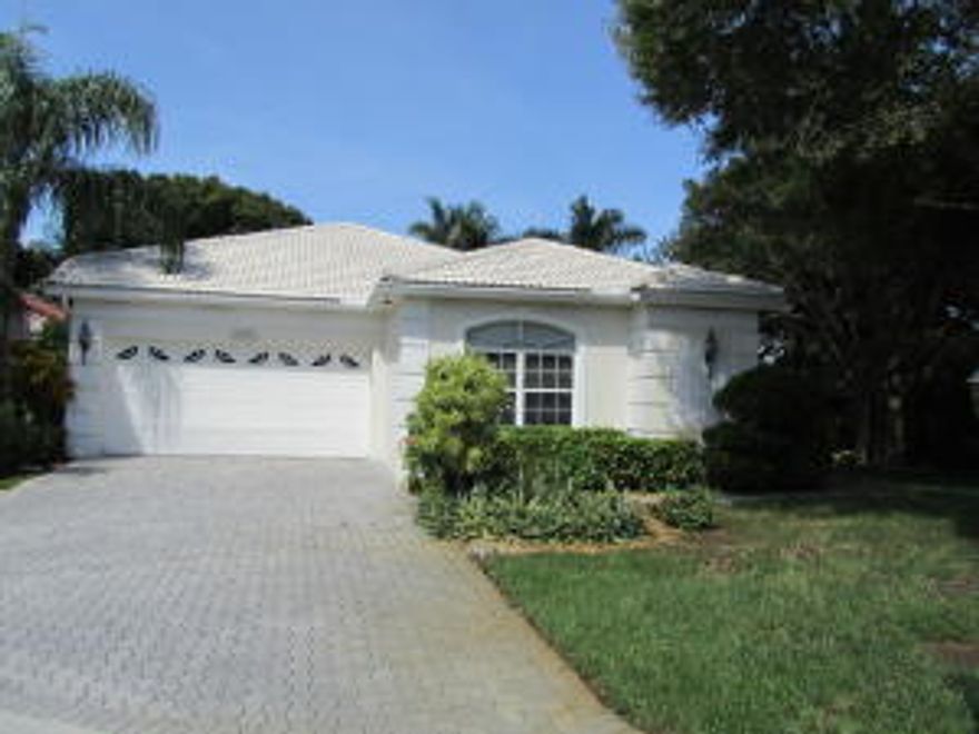 3 bedrooms 2 ½ bathrooms on corner lot.  Lush plantings lead you to the front entrance.  Large white tile throughout living area.  Neutral tones throughout this lovely home.  Convenient bar in living room is great for entertaining.  New washer.  A/C 2 years old.  Water heater 3 years old.  Buyer pays capital contribution of two months maintenance to the homeowner’s association at closing. Boca Pointe country club has incredible optional al-a-carte membership plans available without having to purchase equity.  Boca Pointe is a club where you can define your life in a non-mandatory country club.  Define your membership:  social, golf, tennis.  Define your time:  3 months to 1 year.  Best deal in Boca for country club living.  Enjoy this active tennis, golf, and exercise lifestyle including clubhouse, exquisite dining room, valet parking, state-of-the art fitness center, aerobic & spinning classes, private trainers, heated pool & Jacuzzi & so much more!  Great central Boca location for malls, restaurants, and beaches.