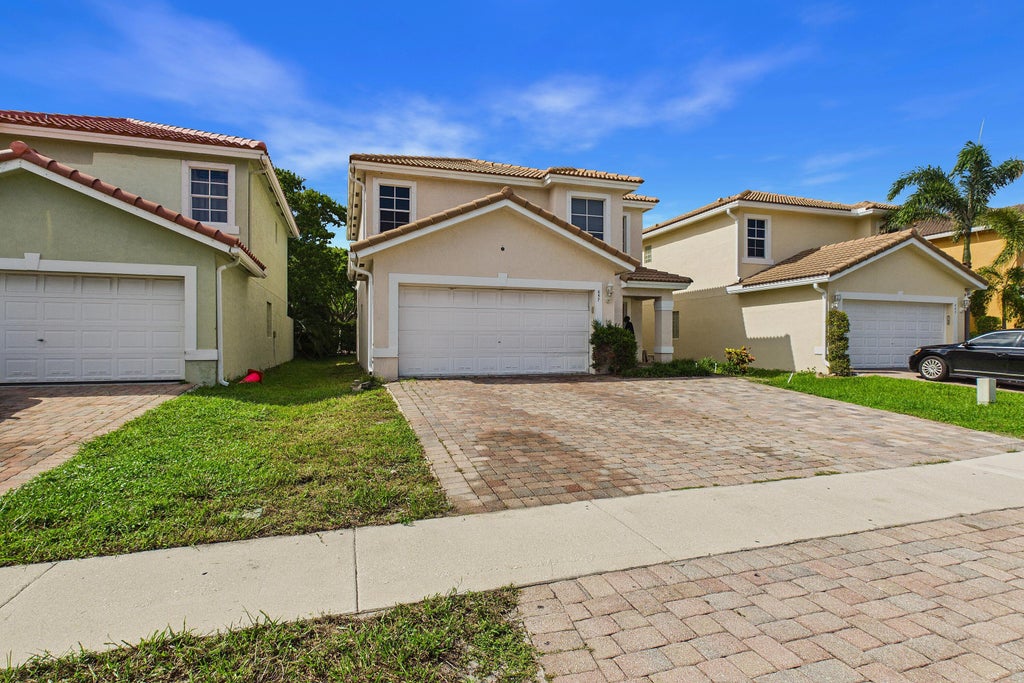 Photo of 657 PERDIDO HEIGHTS Drive, West Palm Beach, FL 33413 (MLS # B26075767)