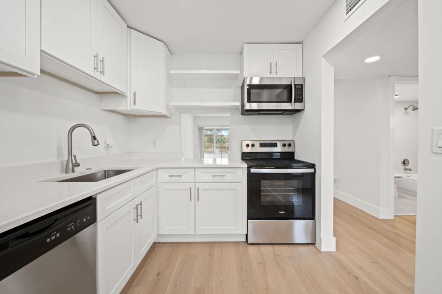 Beautifully remodeled, comfortable 3rd floor 2/2, fully upgraded in adult community, move right in.  Quiet, centrally located for a all year living. Plenty of community amenities, pools, exercise room, clubhouse, transportation, great location close to highways and shopping.  Upgraded electrical panel, tankless water heater, stainless steel appliances, quartz counters, clean and bright with enclosed Florida room.  Extra features in the primary bath, fog free mirror and music speaker.  OK to rent after first year of ownership, maintenance includes water, sewer, garbage and cable. Laundry room, trash shoot on each floor. Association requires application, credit score and income verification; one owner must be 55+, building has reserves. A must show in an active community.