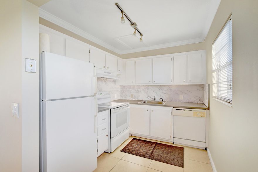 Beautiful, spacious, and move-in ready 2 bedroom, 1.5 bath third floor corner unit in Mansfield. This unit has been freshly painted and is tiled throughout. Kitchen has white cabinets, updated countertops, and white appliances. Additional upgrades include newer a/c, crown molding, smooth ceilings, and a lovely garden view from the patio. Investor friendly. Can be rented out immediately after closing. Century village is a premier 55+ community with resort style amenities including multiple pools, tennis, pickleball, clubhouse, theater, fitness center, library, and the list goes on. Water, cable, internet, 24/7 manned gate, master insurance, and all clubhouse amenities included in monthly condo dues.