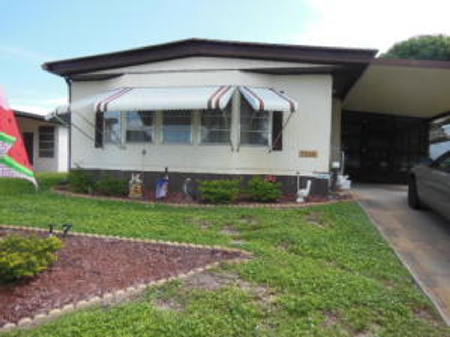 Delightful, spacious double wide, very open floor plan, family room, living room and cozy eat in kitchen. Over sized screened patio plus large laundry/storage room. Great, active 55+ community. Enjoy your winters in sunny Florida.