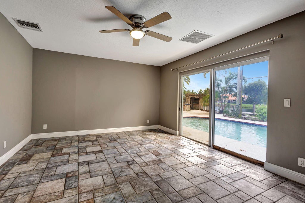 Photo of 1402 Cormorant Road, Delray Beach, FL 33444 (MLS # R11110623)