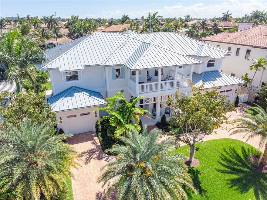 Custom coastal home by Summit Builders designed by Lighthouse Interiors finished late 2017. Sought after location w/ Southern exposure on quiet cul-de-sac. 95' concrete dock. Wide plank Italian hardwoods. Main: open living area w/ formal dining room, gourmet chef's kitchen, double islands, quartz countertops, walk-in pantry and bev. ctr. Cozy gas fireplace in living room. Large club/play room + spacious guest suite. Cabana bath/powder by pool. Patio with gas fireplace, summer kitchen, refrigerator, grill and ice maker. 2nd-floor master with spacious his/her closets, vanities, soaking tub, sitting area. Media room w/ wet bar and large sliding doors out to 2nd floor patio with fabulous waterfront views. 3 large en-suite bedrooms w/ walk-in closets. Laundry rooms on each level.