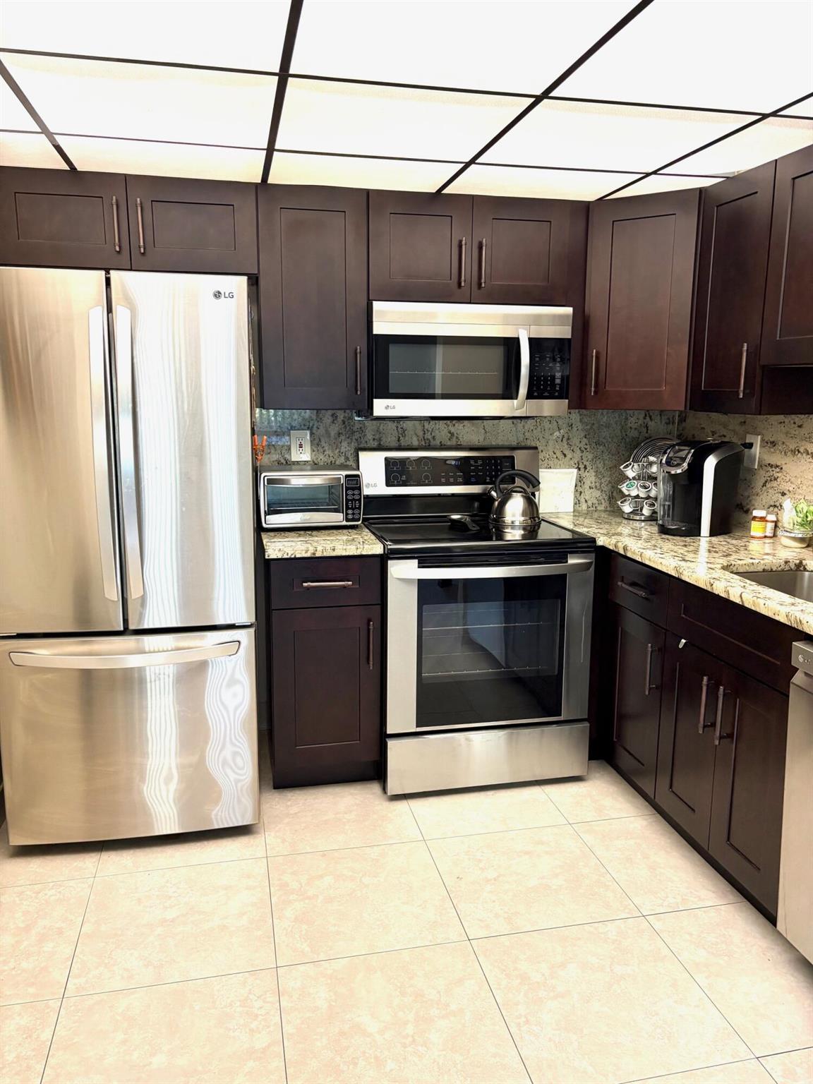 very very clean and updated 1/1.5 ground floor Normandy 'M' unit. Updated bathrooms and kitchen. Kitchen boasts stainless steel appliances which include mounted microwave and dishwasher. Lovely neutral colored tiled flooring. Plenty of storage space. Garden view from your patio. Washer/dryer in your patio utility closet. Furnished nicely. Close proximity to the Flanders Clubhouse and pool area.