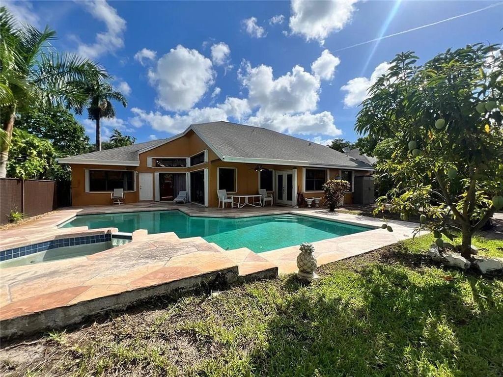 Photo of 4424 NW 52nd St, Coconut Creek, FL 33073 (MLS # F10535944)