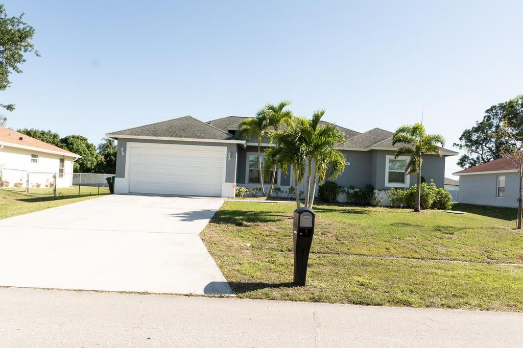 Photo of 556 SW Whitmore Drive, Port Saint Lucie, FL 34984 (MLS # R11082187)