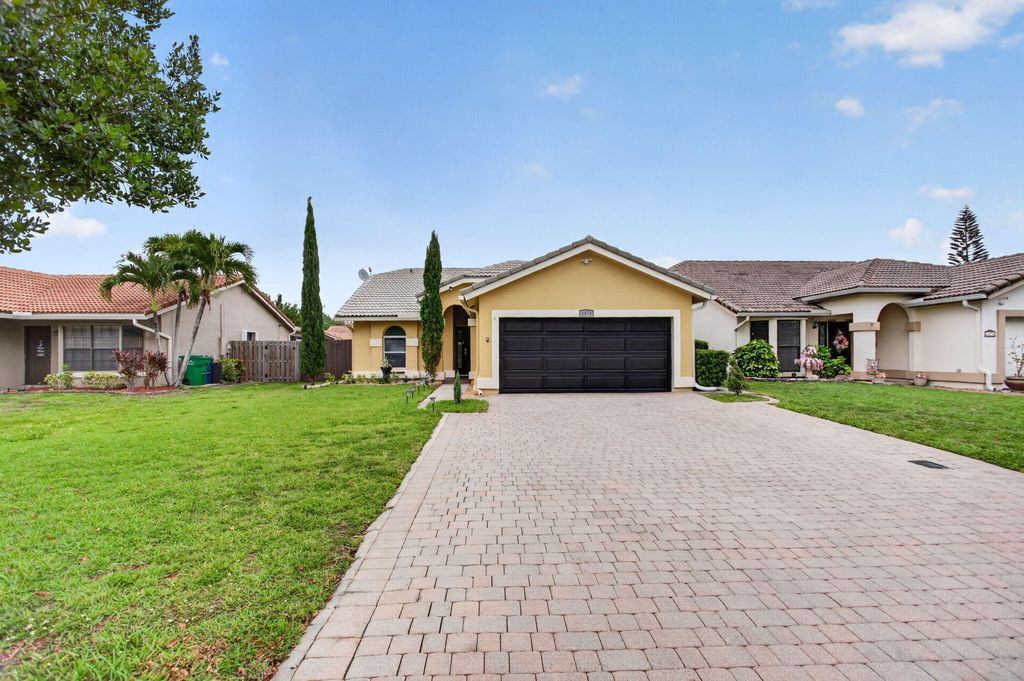 Photo of 1873 NW 97th Terrace, Coral Springs, FL 33071 (MLS # B26021381)