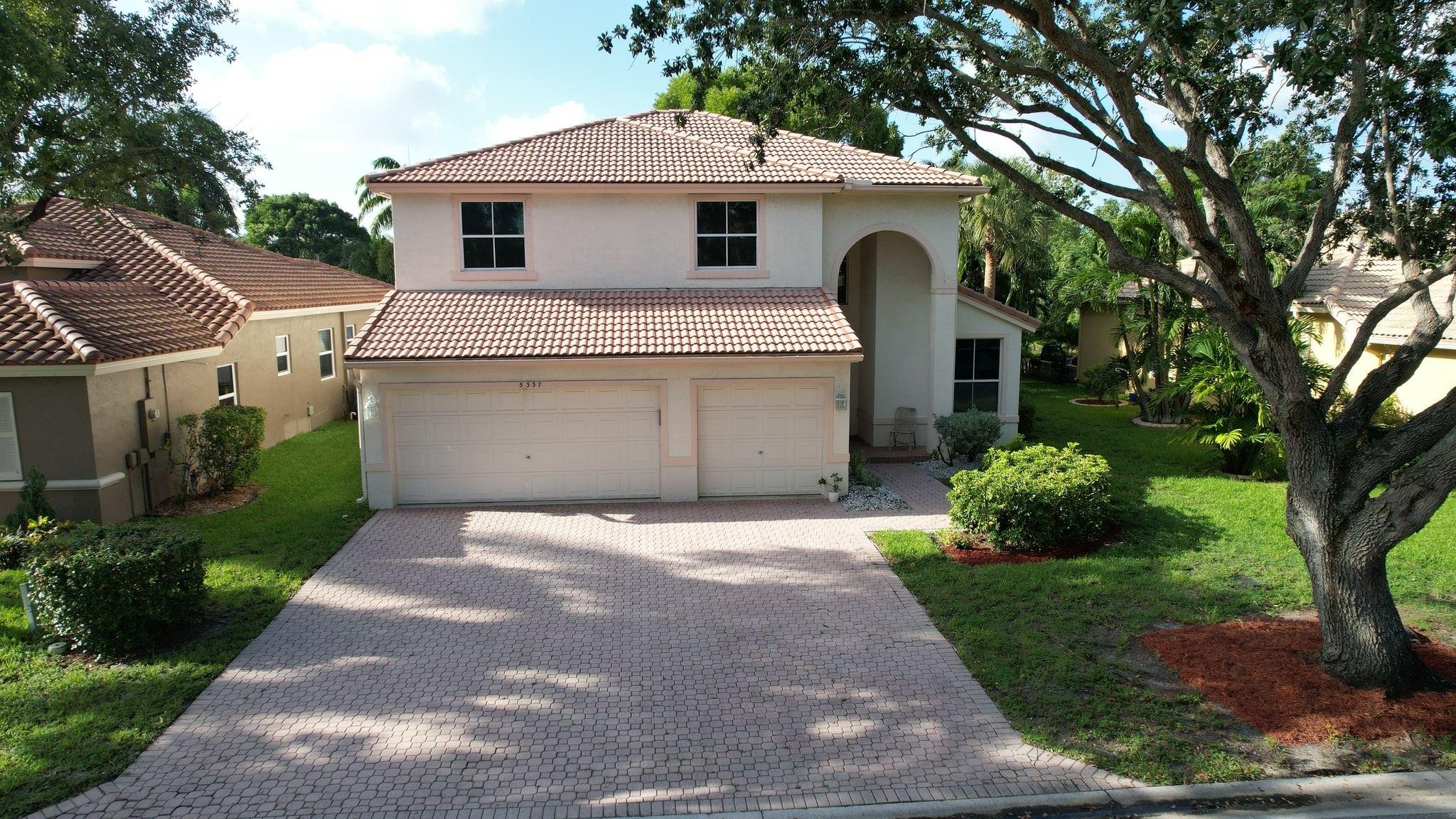 PRICE IMPROVEMENT. Well appointed home in Indigo lakes, two story home has a large paver driveway and a three car garage for all your toys. two new AC units 2023/24,newer water heater 2019 and All Hurricane shutters .The first floor has bedroom and a Cabana bath perfect for in laws, formal dinning room ,living room, wine storage and laundry room. The very large kitchen has an island, plus separate dinning area, walk in pantry, wood cabinets, granite counter tops and lake views. Upstairs you will find an exceptionally large master bedroom with sitting room that could be a nursery or a 5th bedroom, plus two more bedrooms an a third bath. HOA is only $209 and includes ATT-internet, Community pool, kids pool , Gym .Close to the Promenade restaurants. Sawgrass and turnpike easy access .