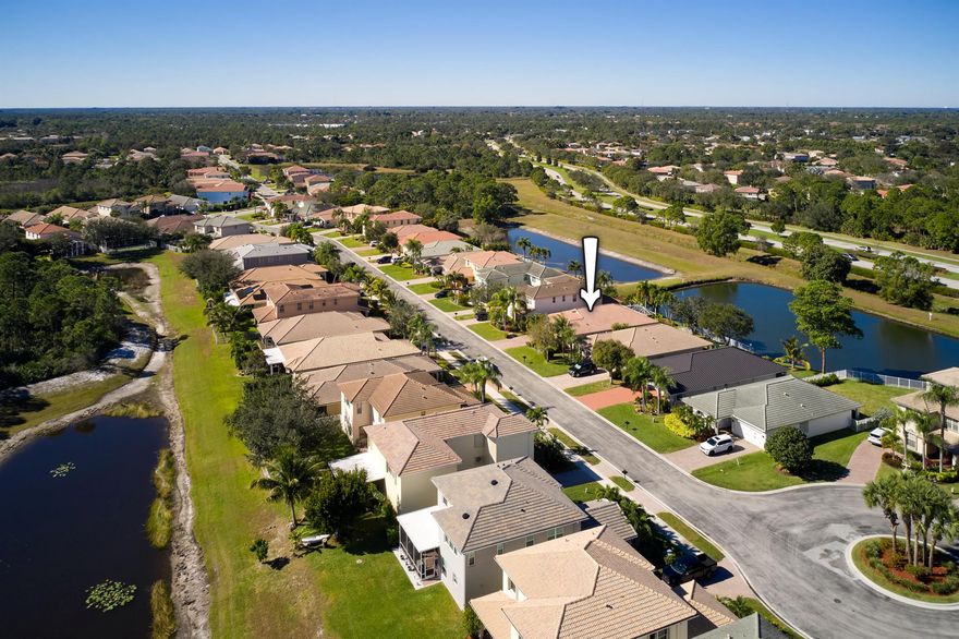 Set along one of the desirable streets in Martin's Crossing, this single-level residence features an inviting front porch elevation and a serene water backdrop. The well-designed split floor plan places guest bedrooms at the front of the home, while the primary suite is privately positioned at the rear. An extended screened-in lanai opens to calming waterside scenery, offering a seamless indoor-outdoor living experience. The home offers three bedrooms and two baths and is located within a family- and pet-friendly community with a low HOA, including lawn care, cable, and internet, as well as access to a community pool, pickleball and tennis courts, fitness center, and children's play area. Ideally situated near I-95 and just minutes from downtown Stuart shopping, dining, and local beaches.