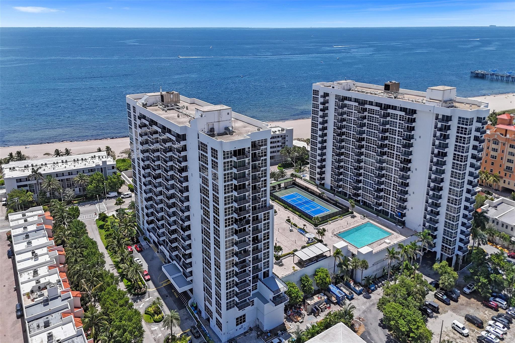 Direct ocean view from your bedroom and living area! North/ East facing. Enjoy this updated, fully furnished unit with impact windows and doors and nice open floor plan. Whether you're looking for a second home or primary resident this is your spot. Across the street from the beach, walking distance to all the great restaurants and fishing pier. Garage parking with one deeded parking space. The building has a gym, 2 pools, outdoor BBQ, bocce ball, tennis courts, pickleball, sauna, library. Plenty of closet space an additional storage unit in the building. Rentals are ok but must hold for 1 year, 3-month min.