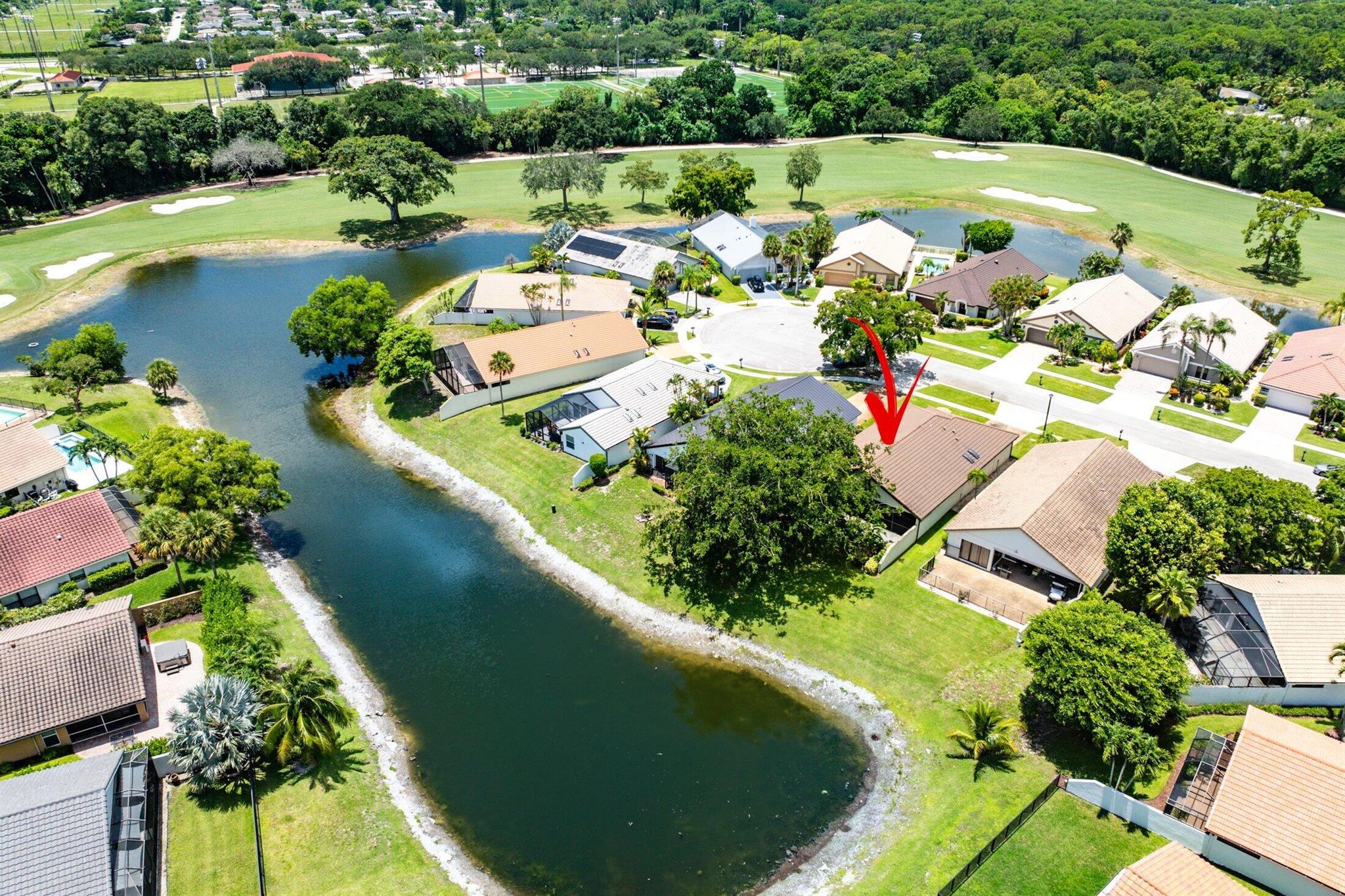 Located in the prestigious Boca Woods Country Club, this updated 3-bedroom, 2-bath home features an open, split floor plan and is perfectly situated on a quiet cul-de-sac. Enjoy exceptional water views from the comfort of your screened-in patio--ideal for relaxing or entertaining.Boca Woods is an all age Country Club Community which offers resort style amenities, including two championship golf courses, Har Tru tennis courts, pickleball courts, state of the art fitness center, spa, game room, fully renovated clubhouse with fine dining and much more! Mandatory Country Club membership required $120,000.