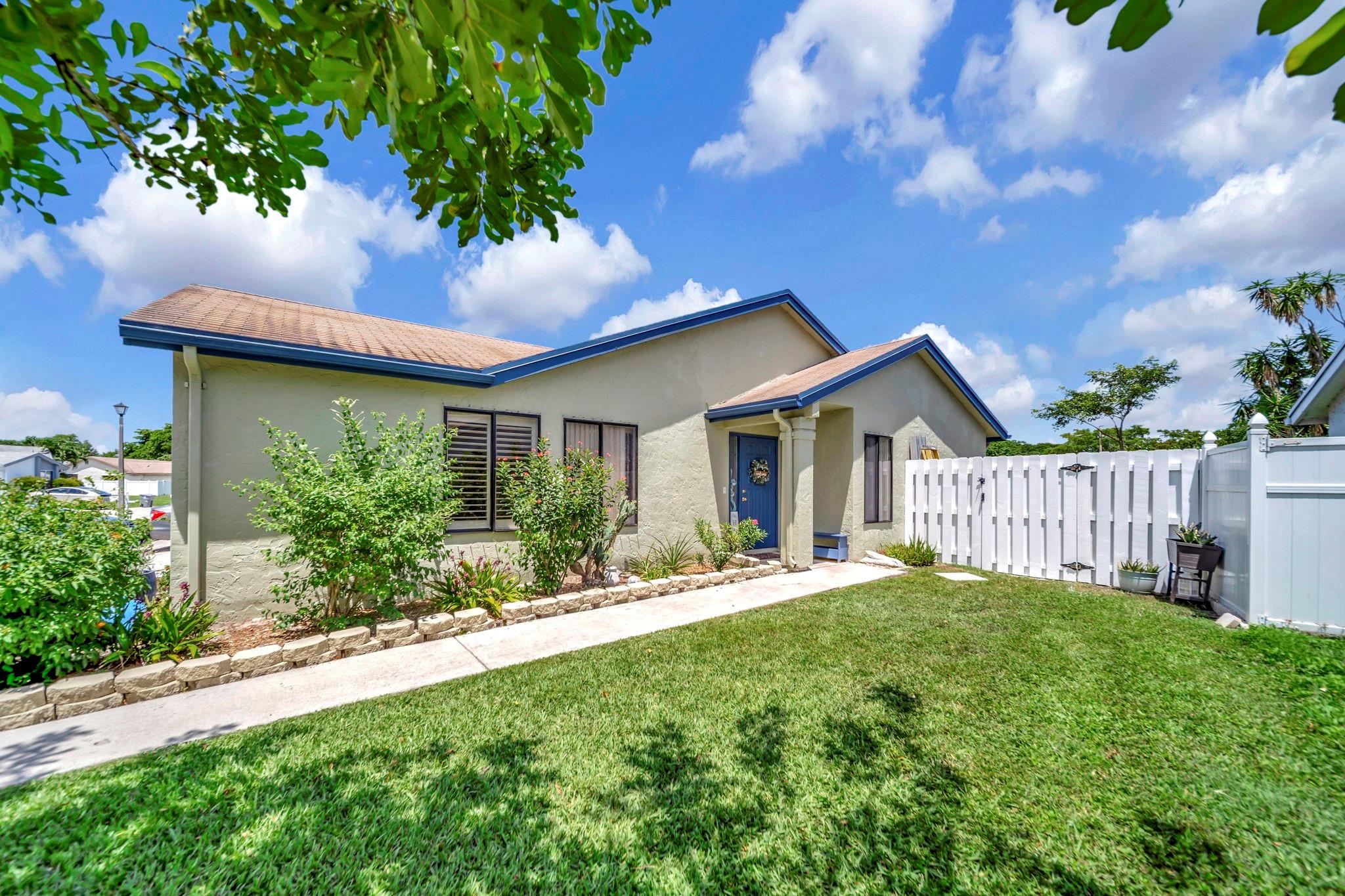 Absolutely gorgeous 2/2 corner lot villa on a cup-de-sac * Prime Boca location * Bring your 2 and 4 legged babies with....hang on the patio or in the fantastic back yard area * Swing in the hammock or get grillin in that fabulous space * You may want to opt-inside for some a/c and cook in the completely remodeled kitchen: granite counters & stainless appliances * Ceramic tile in living areas & laminate floor in the bedrooms. Walk in Closets. * Full size Washer & Dryer in the one car garage * Updated Main Suite has is accented with Plantation Shutters, features a walk in closet and walk in shower. Guest bath has a tub. Super spacious living area....You'll walk in and it just feels like home! Freshly painted and in a well maintained community. This one will go quick!!