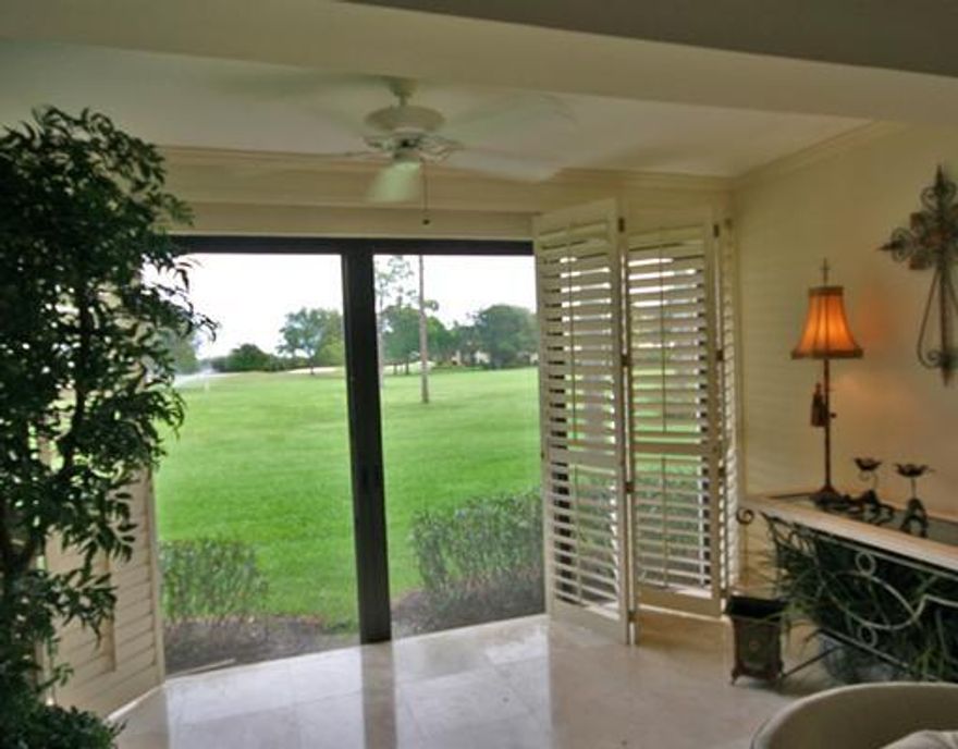 Individual & Inviting 3BR/2BA first floor apartment with lush golf course views. From the moment you step into this home you can feel the welcome. Gorgeous saturnia marble graces the interior living area floors thru out, including kitchen and and baths. Bedrooms floors have neutral carpeting. Crown molding in most rooms and plantation shutters on most windows. Neutral tones and spacious floor plan allows for many different furniture arrangements depending on your needs. The custom kitchen has solid wood extended cabinetry, under cabinet and soffet lighting, delighting any chef. The dining porch has been leveled and makes a very useful breakfast area. All closets have custom built-ins for exceptional storage usage. Fine flourishes throughout! New Clubhouse 2017! Quail Ridge is a private. member-owned community and club. All residents are members of Quail Ridge Country Club and have a choice of either a golf or social/tennis membership.