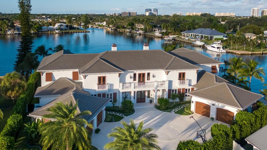 Luxury living in this magnificent custom built home located on a breathtaking lot with 300' of water frontage. This home truly offers only the best. Spectacular water views from the minute you walk in. Built in 2018, 4 bedrooms, 4 full baths, 3 half baths and a cabana bath and shower, 4 car garage and drive through bay (boat room) Total sq. Ft. 16,076, Living Sq. Ft. 10,721. Perfect for entertaining with gourmet kitchen, stunning living room with two fireplaces and floor to ceiling views of the water. Boaters have direct access to the Intracoastal with no fixed bridges and the ability to accommodate a 100 Ft+ yacht. (Lot measures 160 x 160 x 140 x 129 x 55, 30,000lb boat lift and 10,000lb boat lift with deep water dockage), New Concrete Seawall, 300' water frontage on large lagoon/basin - - measures 602' x 750'. All impact windows and doors, 6 A/C units, Security cameras, Speakers in main rooms including back patios, Crestron Smart Home, Ring Doorbell system 5 tankless water heaters,80 KW whole house generator Kohler / natural gas, block, poured solid concrete, double mahogany front doors with glass accents, custom lighting throughout, 2 stone fireplaces with mahogany wood accents 
recessed lighting, Plantation shutters, elevator,  tongue & groove ceilings in living areas and covered lanais, crown molding throughout, mahogany custom ceilings, expansive foyer with herringbone oak wood floors, Living room has floor to ceiling windows and doors leading to covered lanai and pool area with panoramic water, pool/spa and dock views,  formal dining room has wet bar with beverage cooler, separate wine room featuring 2 Subzero coolers for white and for red, cabinetry, shelving and brick accents. Kitchen has walnut cabinetry, marble and quartzite countertops and full backsplash, 6 Ft. Galley Sink, Wolf 60" Range with 6 gas burners pot filler and custom hood, 2 Wolf convection steam ovens, Wolf warming drawer, Wolf convection microwave, 2 Subzero refrigerators with freezers, Subzero 2 drawer beverage cooler, Subzero Ice maker, 2 center islands, one with sink and counter bar and oversized pantry with additional dishwasher and built in Miele coffee machine. Bright breakfast nook, family room with water views, multi use Mud room with built in desks and cabinetry, 1st floor guest bedroom with en-suite bath and 2 floor to ceiling custom armoires. Large laundry room with 2 front load Whirlpool washers and 2 Whirlpool dryers, dog bath, craft area with plenty of counter space and cabinetry and additional private elevator access.
1st floor also has Home Theatre with built in cabinetry and Subzero 2 drawer beverage cooler, Gym with cork floor that overlooks a covered lanai, pool and water, Game room with counter bar, custom ceilings and view of pool, yard and water, 
Impressive dual floating staircases lead to 2nd floor landing and one of the balconies, master bedroom has private covered balcony that overlooks the back entertaining areas and panoramic water views, walk in closets with built in cabinetry and shelving, one has center island and desk/sitting area, master bath has separate soaking tub, steam shower, his and hers vanities, make up area and separate water closet. All bedrooms have en-suite baths, each is uniquely done with high end finishes and custom ceilings. Also on the 2nd floor is a bonus room being used as a sewing and craft space with built in desk and shelving, and a separate AV and storage room and a custom built bunk room.
The outdoor features on this home are perfect for relaxing, entertaining and of course the boating enthusiast. Several 2nd floor covered balconies, 1st floor covered lanais with hidden electric screens, outdoor kitchen with 48" Wolf grill and XL green egg grill, Subzero 2 drawer beverage cooler and bar area, infinity pool with spillover spa, several sunning areas, gas firepit.

This property is in a prime location in the Village of North Palm Beach. Minutes to the new North Palm Beach Country Club featuring the newly redesigned Jack Nicklaus Signature golf course, pool, tennis, and fine dining. Close to beaches, recreation, restaurants and entertainment. Convenient to major highways and Palm Beach International Airport.