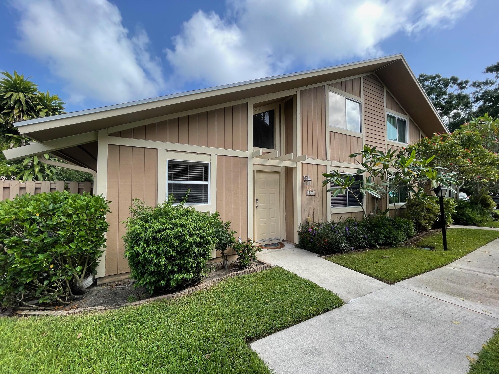 Incredibly spacious 4 bedroom, 3 full bath, plus loft town home. Master on 1st floor, 1 guest bedroom also 1st floor with full bath, 2 bedrooms and 3 bath with loft upstairs. No carpet! Private courtyard. Community offers walking trail around lake, pool, tennis, and tot lot/playground. Great schools, Walking distance to Publix, restaurants, and shops.