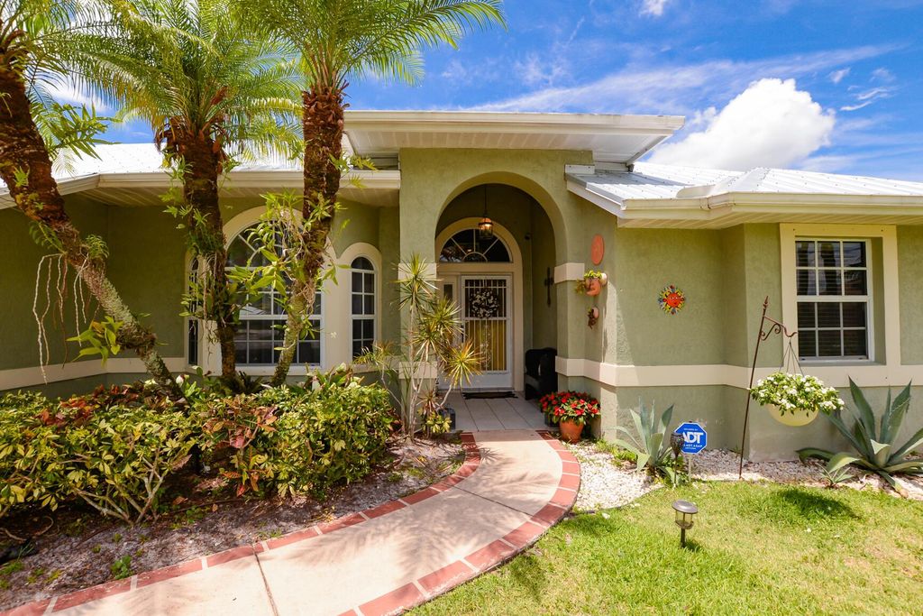 Photo of 6902 NW Jorgensen Rd, Port Saint Lucie, FL 34983 (MLS # R11109729)