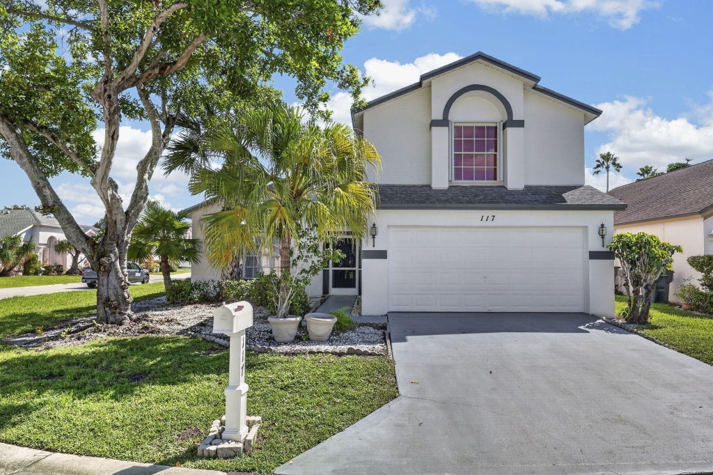 Photo of 117 HAMMOCKS Court, Greenacres, FL 33413 (MLS # B26082063)