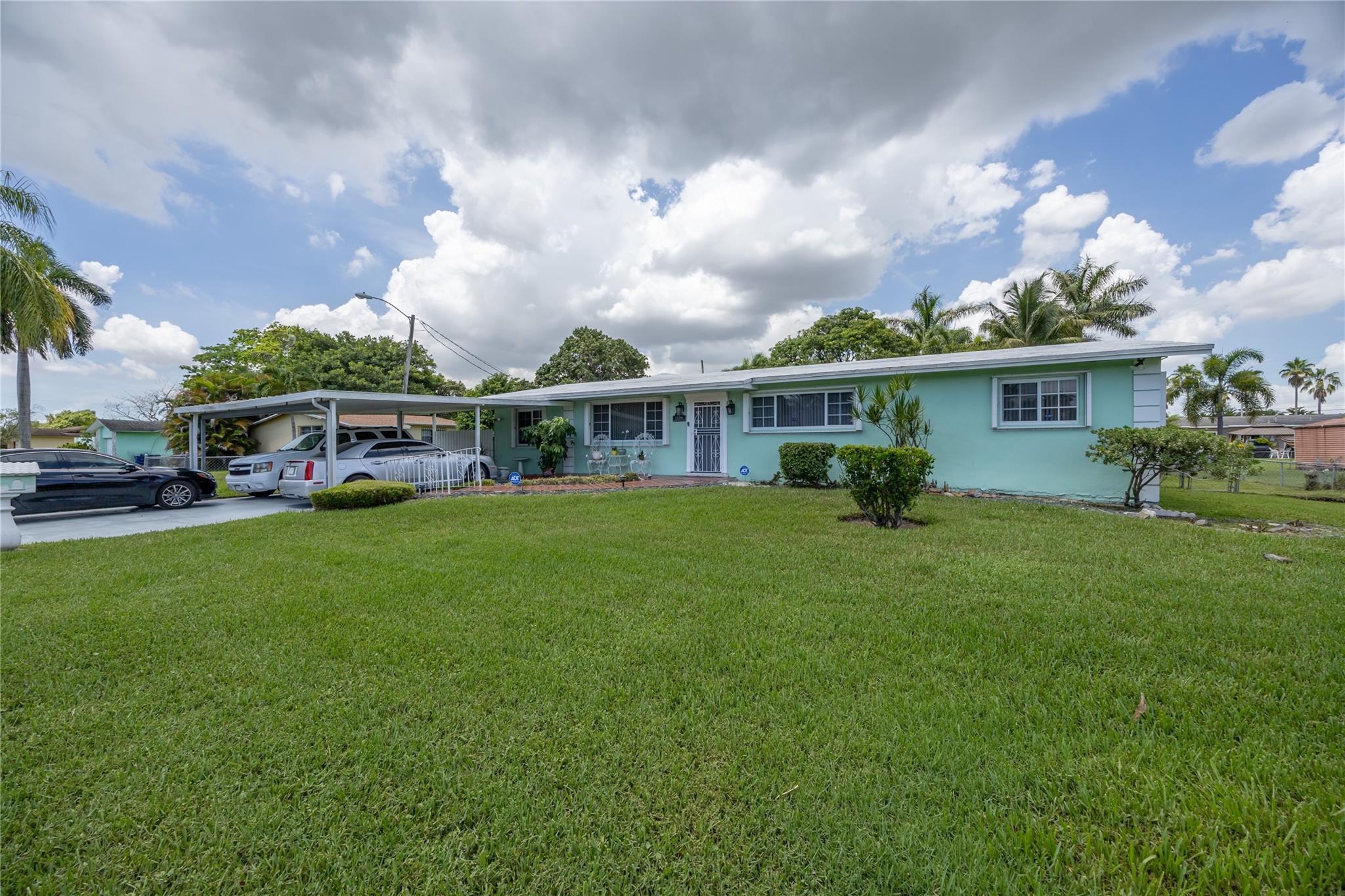 Welcome to this beautifully maintained and spacious home, perfect for both comfort and entertaining! Every bedroom easily fits a king-size bed and features large walk-in closets. It consists of custom drapes, ceiling fans in every room, and tile flooring throughout.
The home boasts a formal dining room, cozy breakfast nook, and a pass-through window connecting the kitchen to the expansive family room—ideal for gatherings. The kitchen features granite countertops, dual sinks, a pantry, and negotiable appliances. French doors lead into a sun-filled family room, creating an inviting space to relax or for a potential multi-generational suite. Enjoy plenty of parking, space for boats or RVs, and a variety of fruit trees including mango, soursop, and coconut. Schedule a showing today!