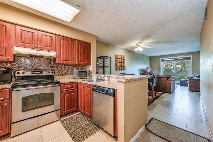 Enjoy TROPICAL WATERFRONT Views from this Handsomely FURNISHED, Move-In Ready Unit...Just Bring Your Swimsuit! Gorgeous, Contemporary Stone Floors in Living Area. Washer/Dryer. Hurricane Impact Windows. Open Kitchen w/Stone Backsplash & Breakfast Bar. Split Bedrooms for Privacy. Lakefront Owner's Suite has Ensuite Bath w/Step-In Shower & Walk-In Closet. Spacious Guest Room has Adjacent Guest Bath w/Tub. Pull Up a Chair & Enjoy the Sea Breezes from Your Front Catwalk (NO BALCONY IN UNIT). Resort Style Amenities Are Right Downstairs. Front Row Parking Spot by Elevator & Stairs. Heated Pool, Tennis & Plenty of Guest Pkg. Jog Trails, Gym, Sauna, Clubhouse, Bird Sanctuary. By Shops/Dining. 12 Min to Beach. 2 Pet <25#. HOA Requires 20% Down, Must Own 3 Yrs. Before Leasing. Lowest HOA Fee in Area