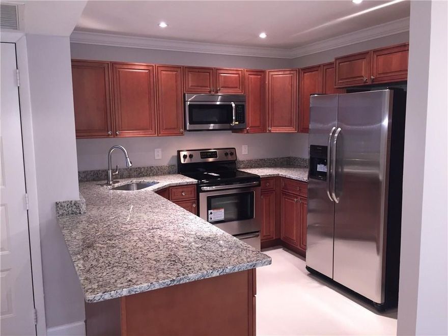 Spacious 3 Bedroom 2 Bathroom Ground Floor Unit At The Township Overlooking Beautiful Lake Views! Featuring Porcelain Tile In Main Living Areas, Wood Flooring In Bedrooms, Brand New Kitchen With Granite And Stainless Steel Appliances, Crown Molding Throughout, Both Bathrooms Brand New Tile/Vanities And Much More! Will Not Last!