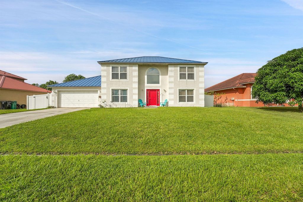 Photo of 4178 SW Tuscol Street, Port Saint Lucie, FL 34953 (MLS # R11128971)