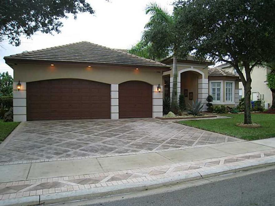 This home shows like a model, you won't be disappointed. Meticulously maintained with plenty of upgrades. Gorgeous kitchen with granite tops, new stainless steel high-end appliances, including a double oven and built in wine cooler. Spa-like master bath w ith large walk-in shower with dual shower heads and beautiful tub in the center of an oversized bath. Just painted inside & out, high ceilings, custom made window treatments & crown moldings throughout house, tile & upgraded hardwood in the bedrooms.