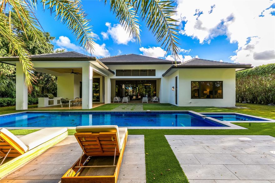 When you pull into the driveway of this custom built masterpiece be ready to fall in love!
This 4 bedroom (all en-suite bathrooms) includes a powder room as well as a cabana bath to compliment the summer kitchen. The “ Great Room” boasts 17ft ceilings with sliding, stackable doors opening up to a gorgeous heated pool and hot tub made for entertaining. The back yard has been turfed and well landscaped for privacy. The master bedroom features his and hers walk-in closets, with an amazing shower and freestanding tub. The additional 3 guest suites and the office/game room with bar are all tastefully finished.

The gated community of Pine Tree is consistently rated in the Top 20 golf courses in Florida and Top 100 in America. Membership is NOT mandatory to Pine Tree Golf Club.