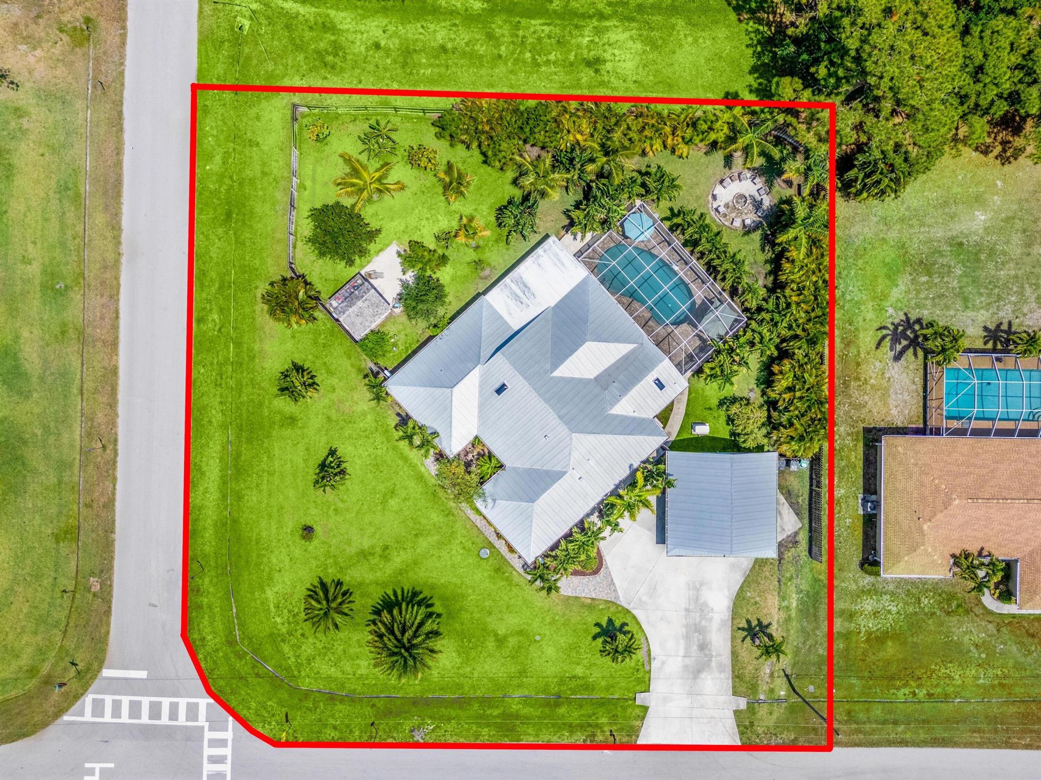 Beautiful move-in ready pool home with upgrades inside and out, located in the desirable Sandpiper Bay area! This one-of-a-kind 4-bedroom, 2.5-bath property sits on over a half-acre of lush, landscaped land, an irrigation system, and a variety of fruit trees, flowering beds, fire pit, a charming shed, and a fully fenced yard. Inside, a welcoming foyer opens to attractive flooring throughout and a dazzling kitchen featuring newer appliances, loads of counter space, and a spacious layout that opens directly to the living area, perfect for entertaining. The luxurious main suite is a must-see with a huge jetted tub and a steamer shower for ultimate relaxation.