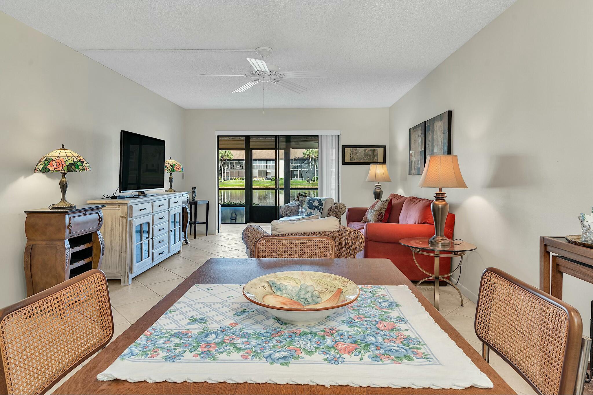 TRANQUIL WATER VIEWS ARE THE FIRST THNG YOU'LL NOTICE WHEN YOU ENTER THIS PERFECTLY LOCATED GROUND FLOOR CONDO LOCATED IN AN ACTIVE 55+ COMMUNITY. FULLY FURNISHED AND ONLY YOUR TOOTHBRUSH NEEDED TO MOVE IN TO THIS LOVELY 2 BEDROOM 2 FULL BATH UNIT WITH A SPLIT PLAN. WALK IN CLOSETS IN BOTH BEDROOMS AND ADDITIONAL STORAGE ON THE LANAI. PLUS YOUR LANAI ADDS LIVING SPACE AND YOU SIMPLY STEP OUT TO THE WALKING PATH FOR A BRISK WALK OR QUICK TRIP TO ONE OF THE 2 POOLS IN THE DEVELOPMENT. TENNIS, BOCCI, PICKLE BALL, LIBRARY, EXERCISE ROOM AND MUCH MORE TO KEEP YOU BUSY. RESTAURANTS, SHOPPING AND EASY ACCESS TO THE TURNPIKE OR A QUICK DRIVE TO THE BEACH. BASIC CABLE AND WATER INCLUDED. ALL MEASUREMENTS & INFORMATION IS APPROXIMATE AND NOT WARRENTED BY OWNER OR AGENT.