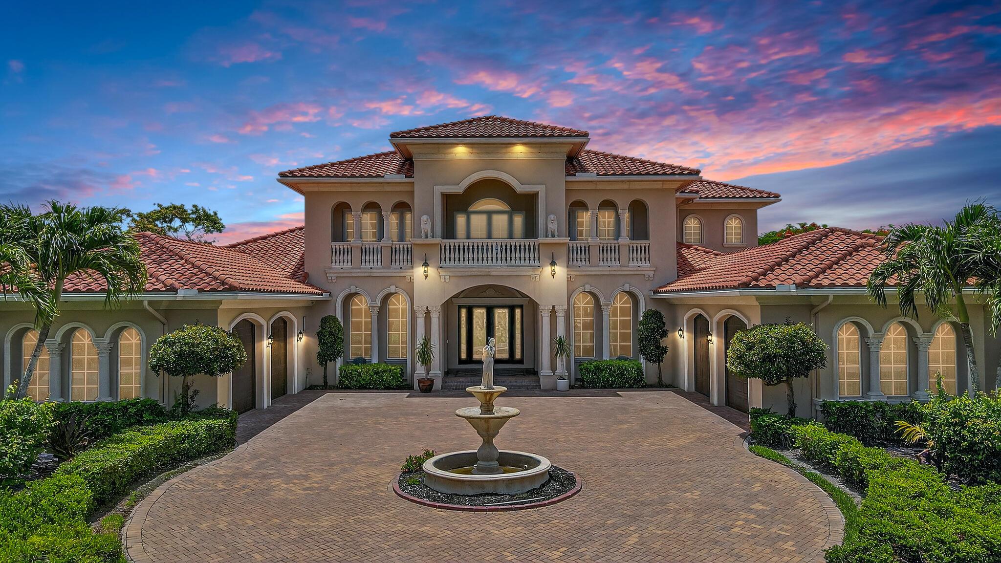 Casual elegance & exquisite craftsmanship define this magnificent custom-built home featuring 6 bedrooms, 7.5 bathrooms & 4 car garage. Situated on over 2 acres, the estate welcomes you with a wide circular driveway & fountain centerpiece. In the grand foyer, gleaming marble floors, a dazzling crystal chandelier & soaring ceilings create an unforgettable first impression. A breathtaking winding staircase sets the tone for the sophisticated design found throughout. The chef's island kitchen is a culinary dream, with 2 wall ovens, a sub Zero refrigerator & gas stove- perfect for entertaining or everyday luxury. Nearly every main room showcases a unique ceiling design, adding character & charm at every turn! Outside is your resort-style oasis. The pool/spa area is framed by elegant walled