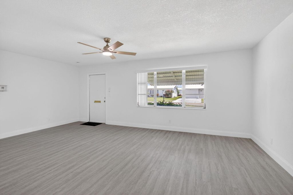 Photo of 703 SW 18th Street, Boynton Beach, FL 33426 (MLS # B26021849)