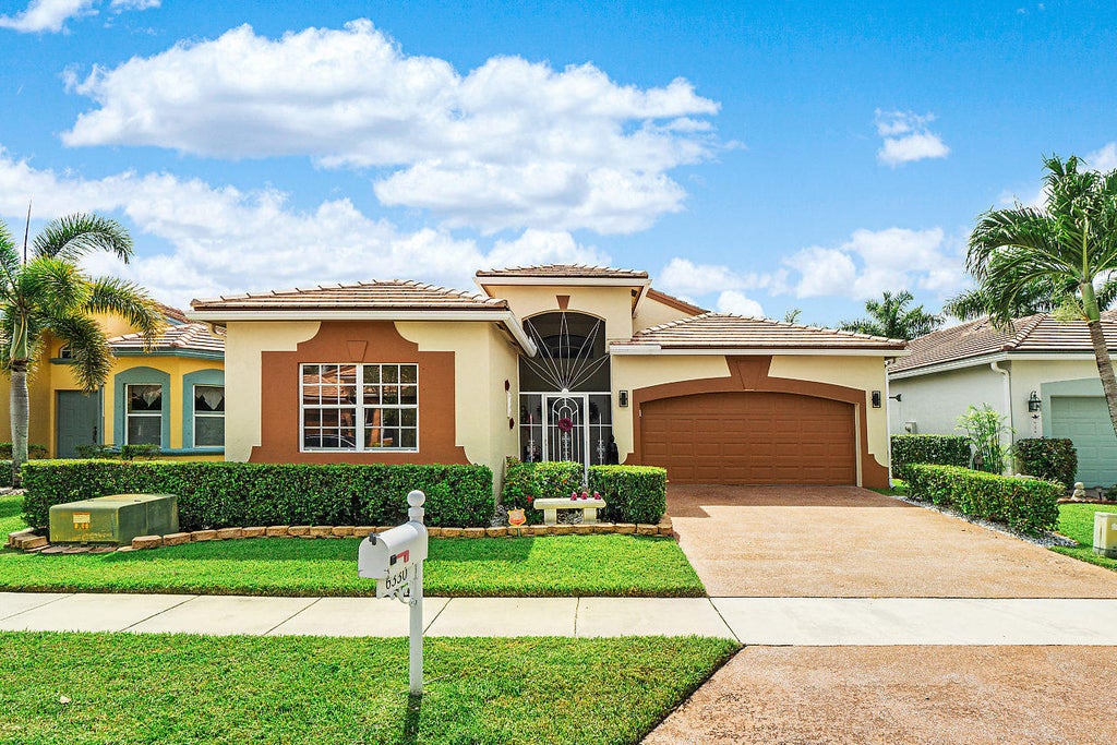 Photo of 6330 HARBOUR OAK Drive, Lake Worth, FL 33467 (MLS # B26070749)