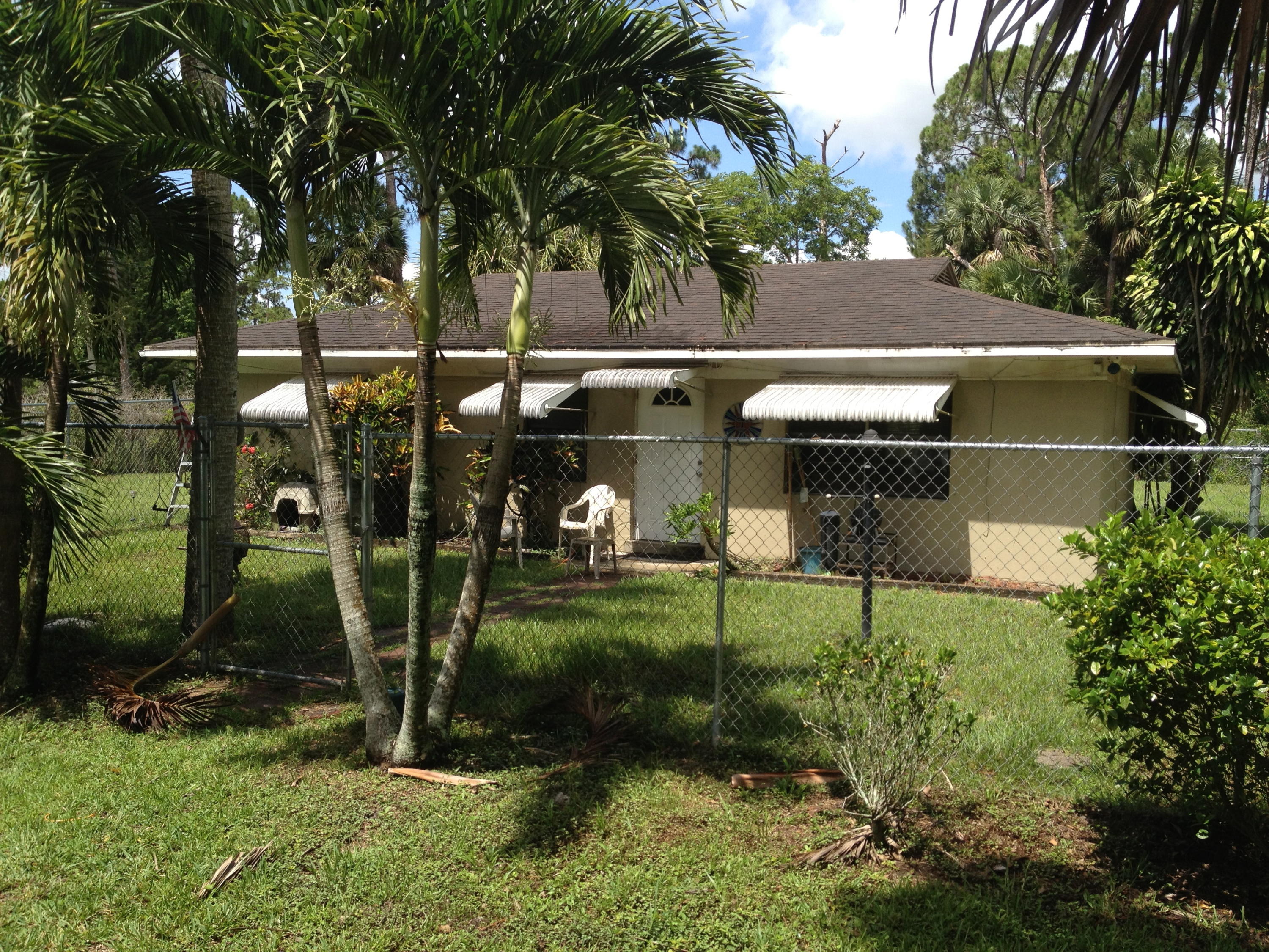 Updated and well-maintained cbs, country cottage situated on 5 high and dry acres.The home is fully tiled, kitchen and bathroom are updated, has a separate laundry room, and is located directly across the street from an 800 acre preserve. Also included is one full R-V hook -up. The property is semi-cleared with plenty of space for a barn and or arena and would not be difficult to clear the remaining portion. The size of the home still allows for a main house to be built with the existing house to be used as a guest house or a home for the elderly. This property is also close to schools, all shopping, and major roads. Property is also fenced.