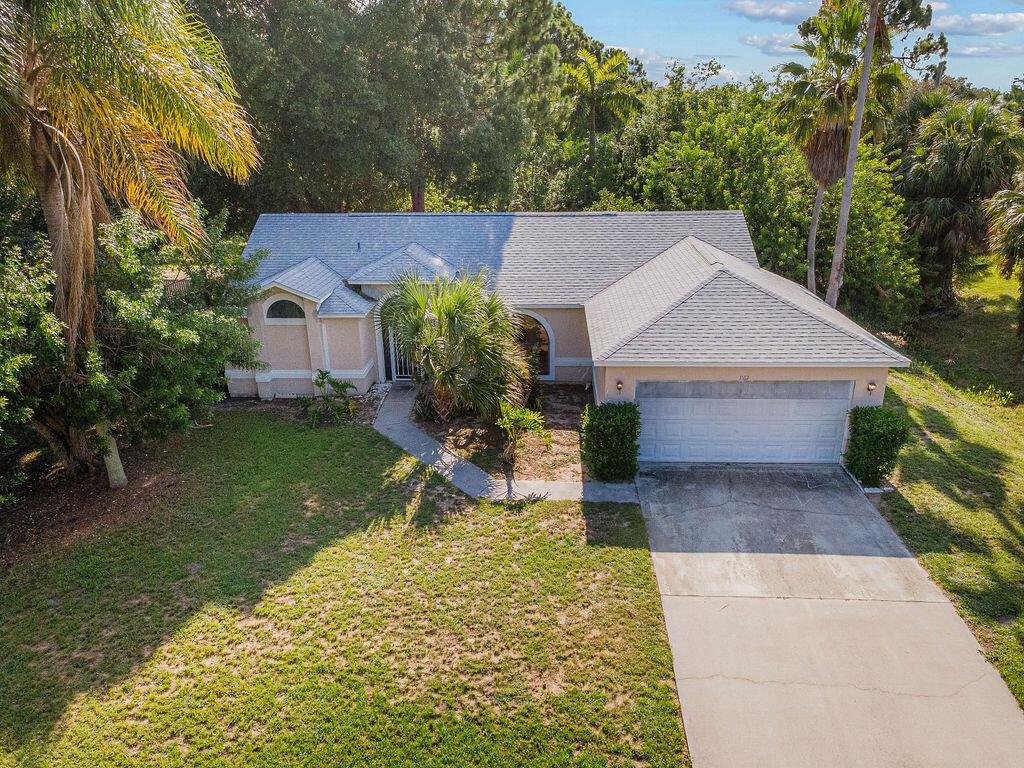 Discover your next chapter in this charming 2-bed, 2-bath home with a 2-car garage in beautiful Sebastian! Step inside to magnificent soaring ceilings and abundant natural light all day. Imagine unwinding on the spacious, west-facing covered patio, savoring vibrant Florida sunsets. The backyard boasts a cool, shady green canopy - the perfect place to relax or host. ROOF 2022Retreat to the oversized master suite, with volume ceilings. The en-suite bathroom is a dream, featuring a double vanity, separate tub, shower, and private toilet area, complemented by a truly spacious walk-in closet. While this home presents an exciting opportunity for personal touches, flexible financing and seller concessions are available to help you transform it. Don't let this incredible potential pass you by
