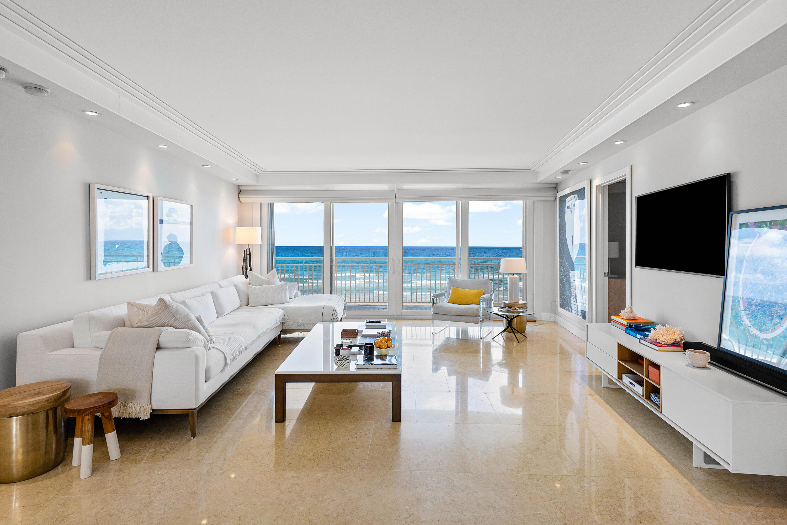 Spectacular direct ocean views from every room in this fully renovated, high-end modern corner apartment, beautifully furnished with exceptional taste. Enjoy sunrises from the East terrace and sunsets from the West. This luxury building offers resort-style amenities including a new fitness center, updated lobbies, 24-hour doorperson, and a stunning pool area. Relax on a wide beach with canvas cabanas and chairs set up daily, right next to the Four Seasons Resort. Close to Palm Beach Par 3 Golf, the Tennis Center, fine dining, shopping, and iconic Worth Avenue.
