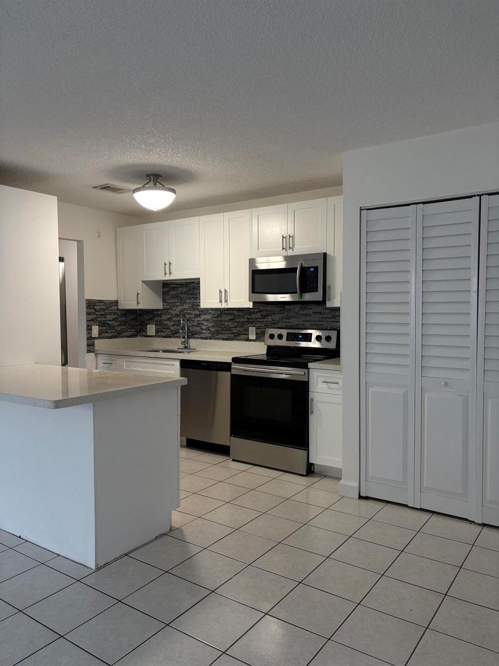 Photo of 4609 Pruden Blvd, Lake Worth, FL 33463 (MLS # R11114510)