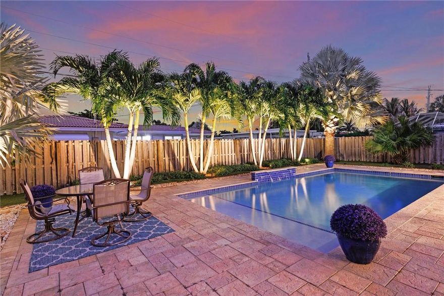 LIGHTHOUSE POINT 3 bed/2 bath pool home ready to enjoy! Spacious resort style backyard features a beautiful pool that receives plenty of direct sunlight & a backyard designed to be low-maintenance, reducing time and effort required for upkeep! The large screened-in porch offers a lovely space to relax and enjoy the outdoors. Inside, the open-style floor plan combines the living room, dining room, and sitting area with neutral tile throughout. The renovated kitchen connects to a spacious indoor laundry room with storage options, and provides access to the one-car garage.  The roof was installed in 2016, and the house is equipped with impact windows & doors for added energy efficiency, updated electric, AC 2015, pool pump 2023 and house was just freshly painted inside and out!  A must see!