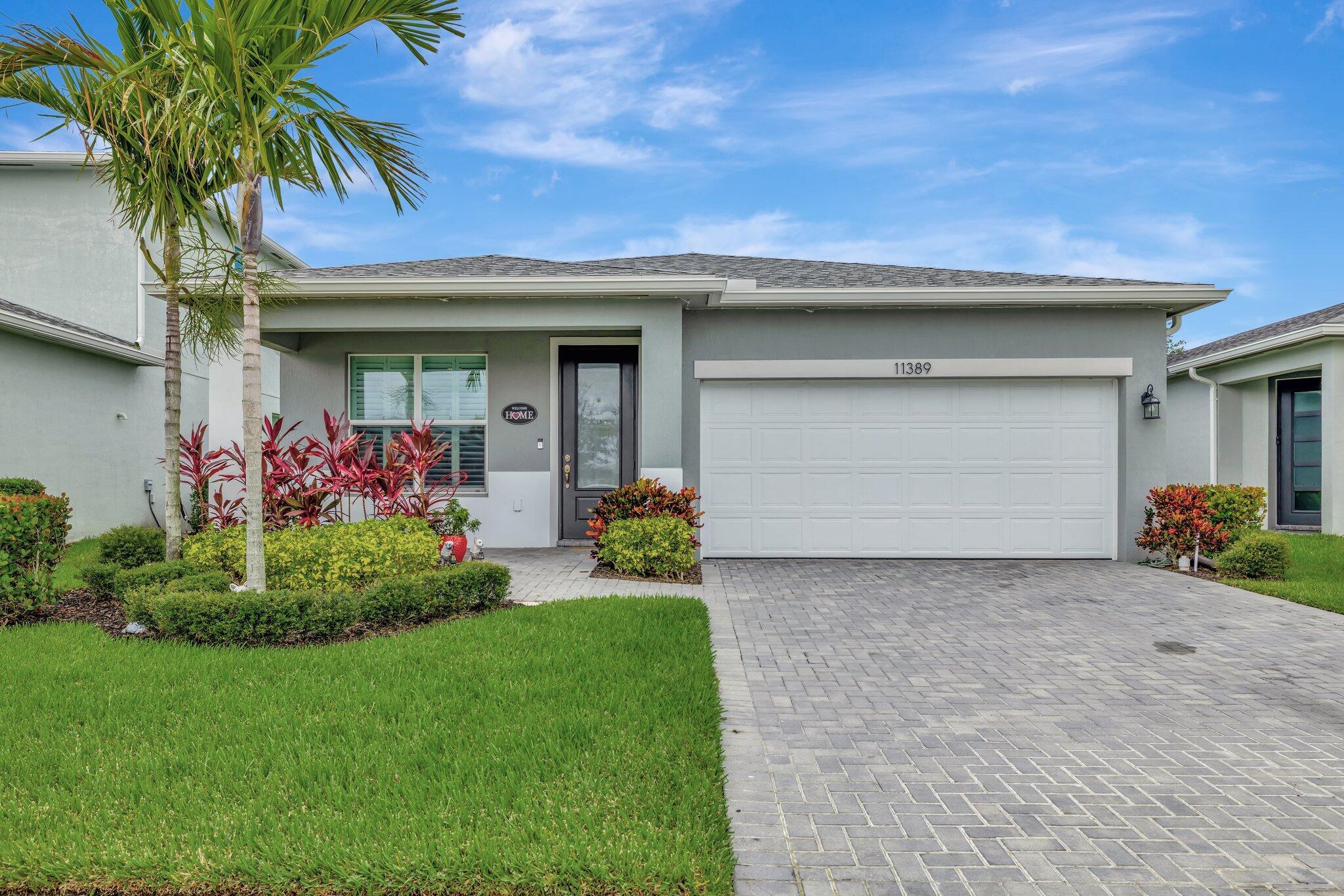 Live the Tradition lifestyle of luxury and community in your newer 4/3/2 in sought-after Manderlie. Impact windows, quartz counters, and a spacious layout are only a few of the many bonuses that this 2021 build boasts. At Manderlie, you are in the heart of Tradition, just minutes from shopping, restaurants, and I95. With low HOA's and plenty of perks, this community has all the bonuses of luxury living mixed with the convenience that comes with owning in Tradition. Manderlie amenities include gated entrance, lawn care, pest control, event lawn & greenspace, clubhouse, fitness center, community pool, dog park, sports court, and basic cable. Come see this beauty in person! Make this your own piece of paradise!