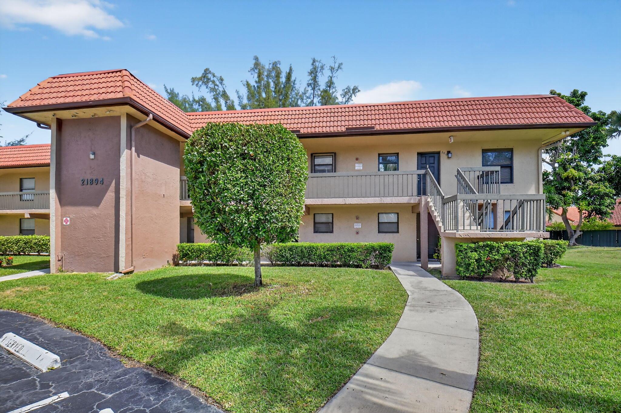 Welcome to this ground floor 2 bed, 2 bed corner unit featuring a modern updated kitchen with two sinks, tile throughout, and lake views from the enclosed patio. Enjoy the community pool and living in close walking distance to stores, schools, and houses of worship.