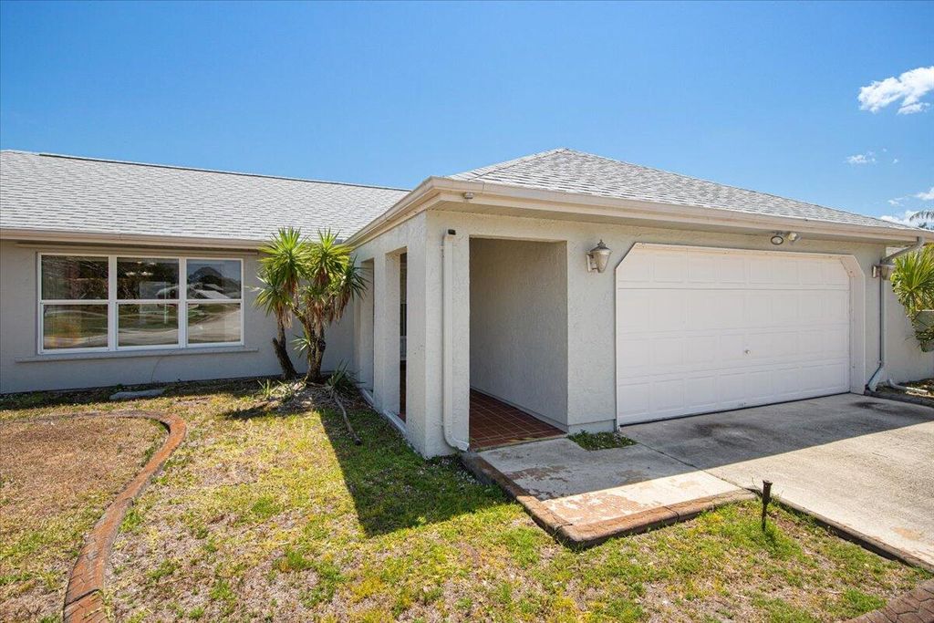 Photo of 2437 SE Drayton Road, Port Saint Lucie, FL 34952 (MLS # R10981994)
