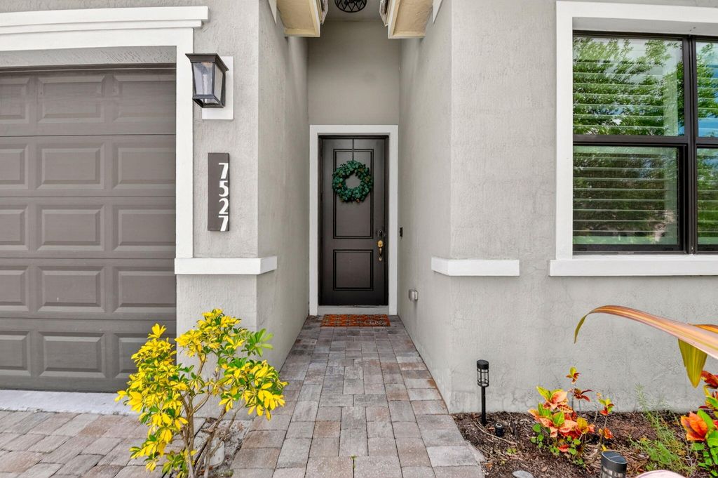 Photo of 7527 Moonrise Drive, Lake Worth, FL 33467 (MLS # B26018672)